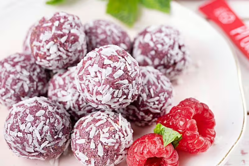 Vegan energy balls with raspberries and coconut